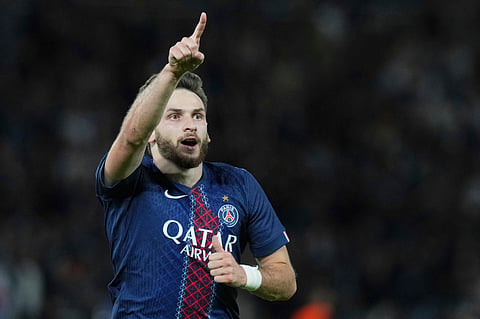 PSG's Khvicha Kvaratskhelia celebrates after scoring his side's second goal during the Champions League opening phase soccer match between PSG and Atalanta on Wednesday, Sept. 17, 2025.