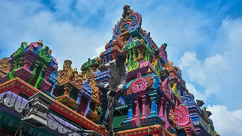 Workers setting up CC cameras at the Kanaka Durga temple premises ahead of Dussehra festivities atop Indrakeladri hill in Vijayawada on Wednesday.