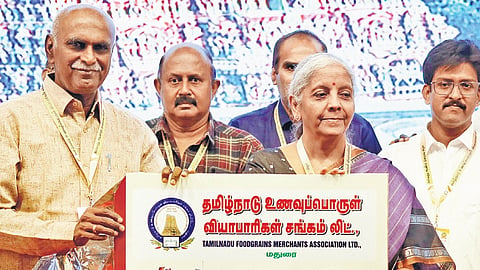 Union Finance Minister Nirmala Sitharaman releasing a book during the 80th anniversary celebrations of TN Foodgrains Merchants’ Association 