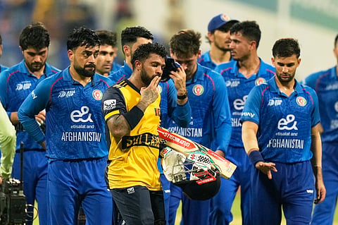 Sri Lanka's Kusal Mendis, foreground, reacts after winning the Asia Cup cricket match against Afghanistan at Zayed Cricket Stadium in Abu Dhabi, United Arab Emirates, Thursday, Sept. 18, 2025. 