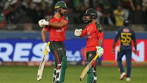 Bangladesh's Saif Hassan, left, and batting partner Towhid Hridoy celebrate scoring runs during the Asia Cup cricket match between Bangladesh and Sri Lanka at Dubai International Cricket Stadium in Dubai, United Arab Emirates, Saturday, Sept. 20, 2025. 