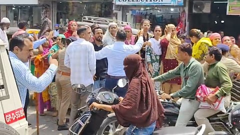 Crowds clashed, stones were thrown, and more than 50 people were detained as police restored order amid heightened communal anxiety.