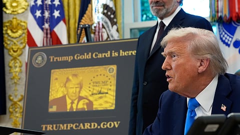 President Donald Trump speaks as Commerce Secretary Howard Lutnick listens in the Oval Office of the White House, Friday, Sept. 19, 2025, in Washington. 