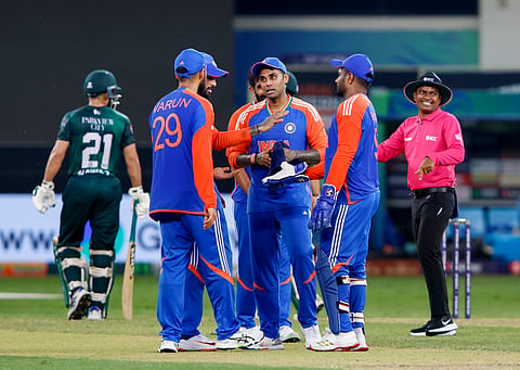 India's captain Suryakumar Yadav celebrates with teammates after the wicket of Pakistan's Mohammad Nawaz during the Asia Cup 2025 Super Four match between India and Pakistan, in Dubai, UAE.