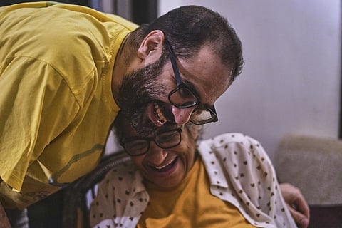 Pro-democracy Egyptian-British activist Alaa Abd el-Fattah, who was in prison for almost all of the past 12 years, hugs his mother Laila Soueif, as he arrives at his home, after a presidential pardon, in Cairo,  Egypt, Tuesday, Sept 23, 2025.