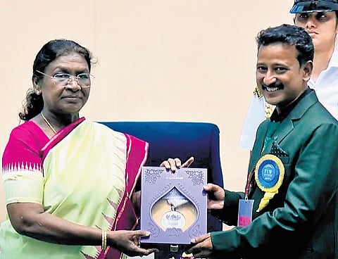 Pushkara director Subharansu Das and OTV business head Litisha Mangat Panda receiving the award from President Droupadi Murmu at New Delhi on Tuesday 