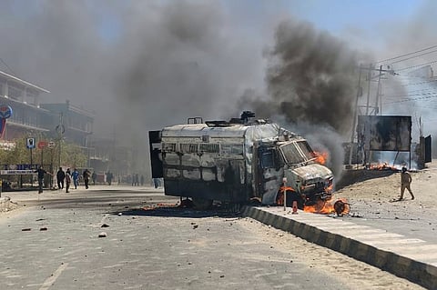 A police vehicle is set on fire during a protest by locals demanding federal statehood from the Indian government, in the high-altitude Leh town, in the region of Ladakh, India, Wednesday, Sept. 24, 2025. 