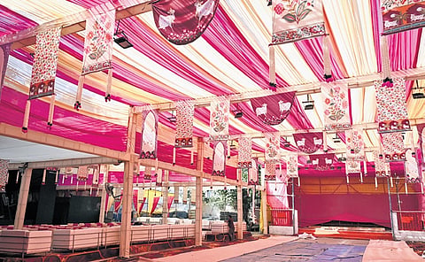 Preparations underway as workers construct a Durga Puja pandal at Timarpur on September 25, 2025 in New Delhi.