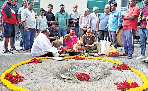 Residents perform pooja to a pothole in Bengaluru on Saturday 