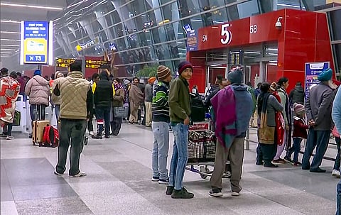 Passengers wait at Terminal-3 of the Indira Gandhi International Airport in New Delhi.