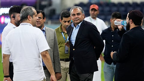 Pakistan's Minister of Interior and President of the Asian Cricket Council Mohsin Naqvi, center, stands with officials on the field after India won the Asia Cup cricket final against Pakistan on Sunday, Sept. 28, 2025. 