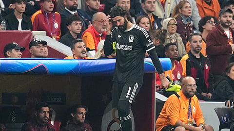 Liverpool goalkeeper Alisson Becker walks near the sideline after being substituted off for a possible injury during the UEFA Champions League, league stage soccer match at RAMS Park in Istanbul, Turkey, Tuesday, Sept. 30, 2025. 