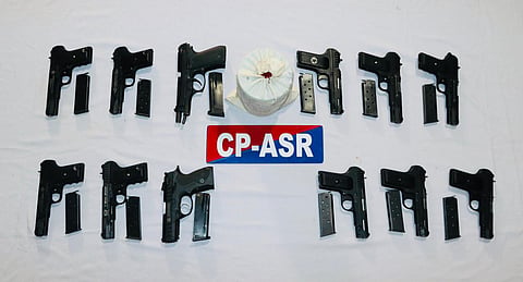Authorities recovered 12 sophisticated .30 bore pistols and 1.5 kg of heroin from their possession.