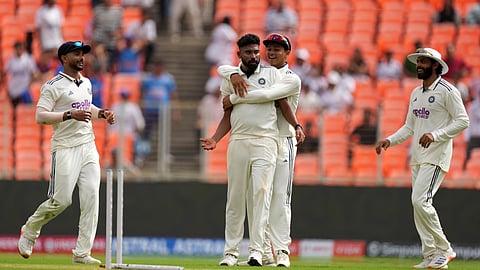 India's Mohammed Siraj, center, celebrates with teammates after the dismissal of West Indies' Brandon King on the first day of the first Test cricket match between India and West Indies on Thursday, Oct. 2, 2025.
