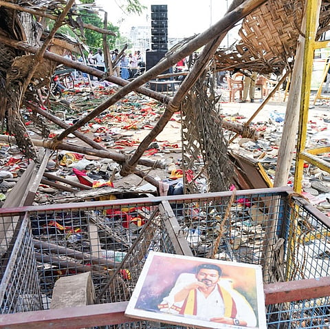 Party flag and chappels after the rampage at the TVK leader campaign rally in Karur 