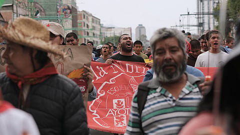Demonstrators march during a protest commemorating the anniversary of the 1968 Tlatelolco killings, when soldiers fired on student protesters, in Mexico City, Thursday, Oct. 2, 2025. 
