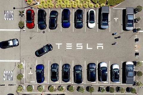 Tesla vehicles line a parking area at the company’s Fremont, Calif., factory, Aug. 5, 2025. 
