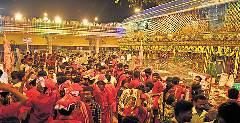 The premises of Kanaka Durga temple atop Indrakeladri hill turned red as devotees who took bhavani deeksha throng take darshan of the goddess on Thursday 