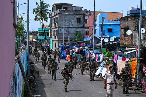 Flag march by security personnel at Bauxi Bazar area as the city comes to a standstill after a 36-hour curfew imposed in the silver city over communal violence in Cuttack on Monday. 