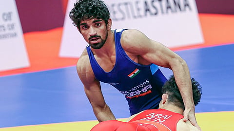 India's Aman Sehrawat in action in the men's freestyle 57 kg category at the 2023 Asian Games in Hangzhou, China. 