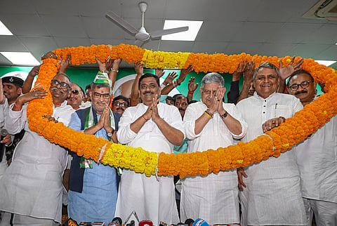 D(U) national executive president Sanjay Kumar Jha and Union Minister Lallan Singh welcome former MP Arun Kumar as he rejoins the party ahead of the Bihar Assembly elections, in Patna, Bihar, Saturday, Oct. 11, 2025. Other party leaders were also present at the event. 