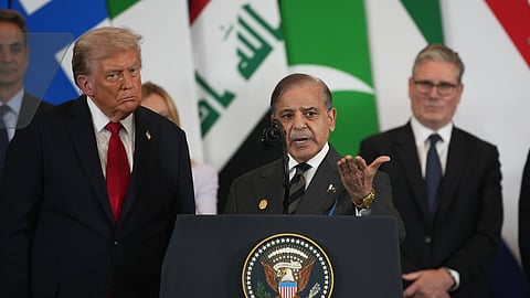 Flanked by President Donald Trump, Pakistan Prime Minister Shehbaz Sharif speaks during the Gaza International Peace Summit in Sharm el-Sheikh, Egypt, Monday, Oct. 13, 2025.