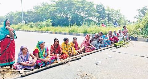 Women blocking NH-53 at Jamurda in Bargarh district on Tuesday 