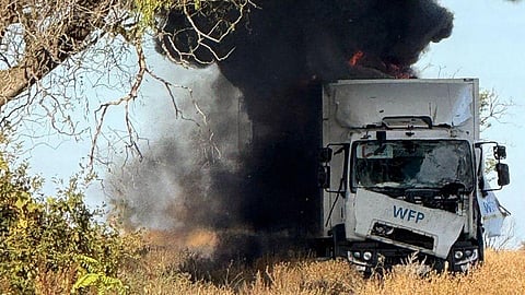 This handout photograph taken and posted on the official Telegram channel of Head of the Kherson Military Administration Oleksandr Prokudin on October 14, 2025, shows a burning UN OCHA truck following a drone attack in Bilozerka, Kherson region, amid the Russian invasion of Ukraine.
The United Nations on October 14, 2025 slammed a Russian drone attack on its aid convoy in the southern Ukrainian region of Kherson, saying the bombardment could amount to a war crime.