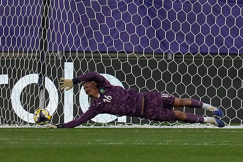 Morocco's goalkeeper Abdelhakim Mesbahi stops a penalty kick by France's Djylian Nguessan during a shootout in a FIFA U-20 World Cup semifinal soccer match at Elias Figueroa Brander Stadium in Valparaiso, Chile, Wednesday, Oct. 15, 2025 