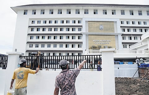 Workers giving finishing touches to the new Corporation building, 
set to be inaugurated on October 21 | A Sanesh 