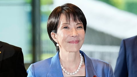 Newly elected Prime Minister Sanae Takaichi arrives at the prime minister's office in Tokyo, Japan, Tuesday, Oct. 21, 2025.