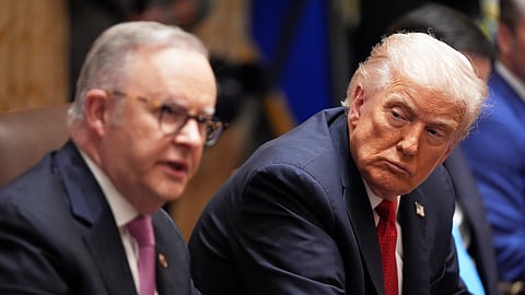 President Donald Trump, right, listens as Australian Prime Minister Anthony Albanese speaks in the Cabinet Room of the White House, Monday, October 20, 2025, in Washington. 