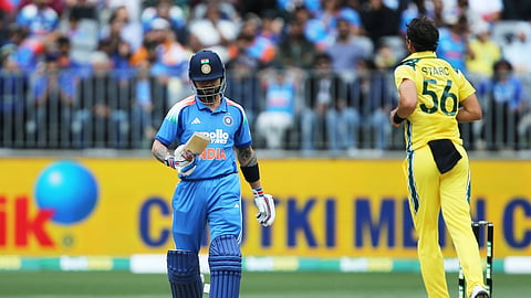 India's Virat Kohli, left, walks off after being dismissed by Australia's Mitchell Starc during the one-day international cricket match between Australia and India in Perth, Australia, Sunday, Oct. 19, 2025.