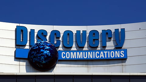 FILE - The Discovery Communications logo atop its headquarters in Silver Spring, Md, July 31, 2017. 