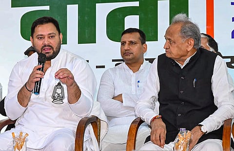 RJD leader and Leader of Opposition in Bihar Assembly Tejashwi Yadav addresses INDIA bloc press conference, in Patna, Thursday, Oct. 23, 2025. Congress leader Ashok Gehlot is also seen. 
