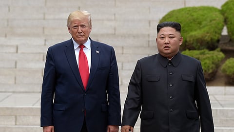 Then U.S. President Donald Trump, left, meets with North Korean leader Kim Jong Un at the North Korean side of the border at the village of Panmunjom in Demilitarized Zone, on June 30, 2019. 