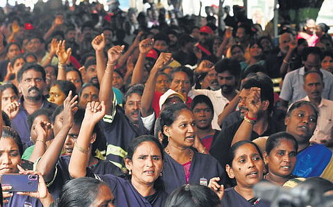Workers staged a hunger strike near Rajarathinam Stadium, Egmore, on Saturday, condemning the dismissal of workers by the GCC