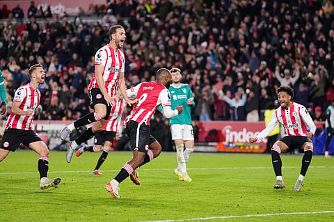 Brentford's Jordan Henderson, second from left, celebrates after Igor Thiago (9) scored from the penalty spot for their third goal during the Premier League soccer match between Brentford and Liverpool in London, Saturday, Oct. 25, 2025.