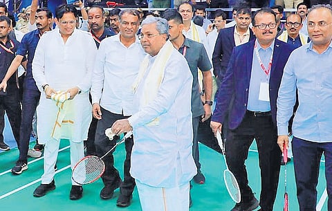 Chief Minister Siddaramaiah attempts a serve after inaugurating the Chief Minister’s Mangalore India International Challenge 2025, in Mangaluru on Monday 