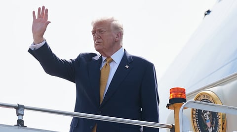 President Donald Trump waves as he boards Air Force One at Kuala Lumpur International Airport in Sepang, Malaysia, as he departs for Japan, Monday, Oct. 27, 2025. 
