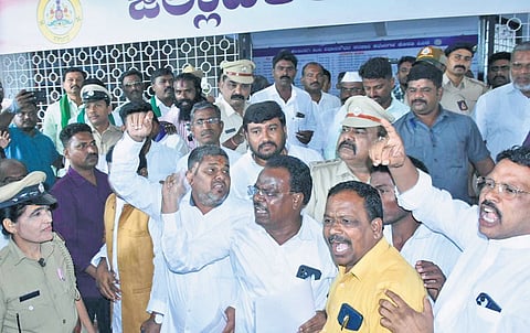 Leaders of Dalit organisations shout slogans against RSS after a peace committee meeting in Kalaburagi on Tuesday  