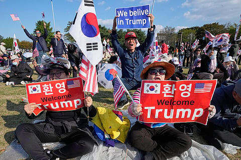 Supporters of U.S. President Donald Trump attend a rally to welcome his visit in Gyeongju, South Korea.