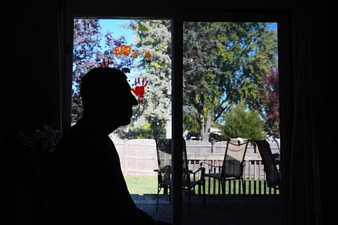 Bill Swick sits on the chair at his home in Minooka, Ill., Friday, Oct. 24, 2025. 