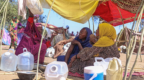 Sudanese who fled El Fasher city after Sudan's paramilitary forces killed hundreds of people in the western Darfur region speak at their camp in Tawila, Sudan, Wednesday, Oct. 29, 2025.