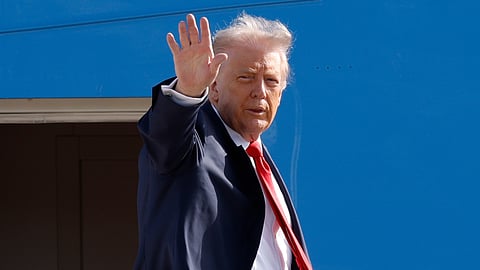 President Donald Trump waves from the stairs of Air Force One as he boards upon his arrival at Joint Base Andrews, Md., Friday, Oct. 31, 2025, en route to his Mar-a-Lago estate in Palm Beach, Florida. 