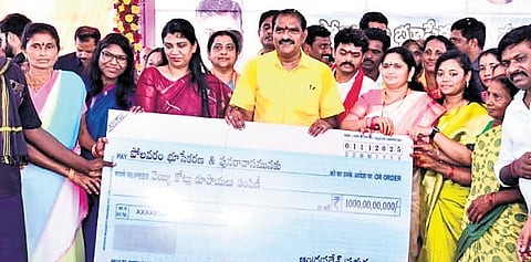 Water Resources Minister N Ramanaidu distributes Rs 1,000 crore compensation to Polavaram project displaced families at Velerupadu on Saturday 