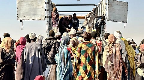 This photo released by The Norwegian Refugee Council (NRC) shows displaced families from el-Fasher at a displacement camp where they sought refuge from fighting between government forces and the RSF, in Tawila, Darfur region, Sudan, Friday, October. 31, 2025.