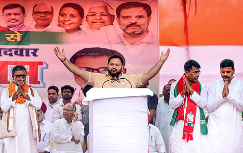 RJD leader Tejashwi Yadav addressing a poll rally in Bihar. 