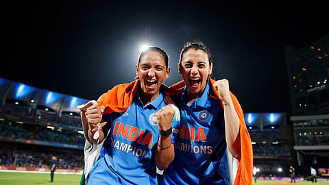 India's captain Harmanpreet Kaur (L) celebrates with her deputy Smriti Mandhana after winning the ICC Women's Cricket World Cup final match between India and South Africa in Navi Mumbai, India, Sunday, Nov. 2, 2025. 