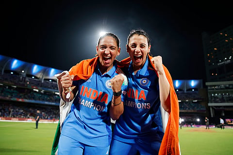 India's captain Harmanpreet Kaur (L) celebrates with her deputy Smriti Mandhana after winning the ICC Women's Cricket World Cup final match between India and South Africa in Navi Mumbai, India, Sunday, Nov. 2, 2025. 